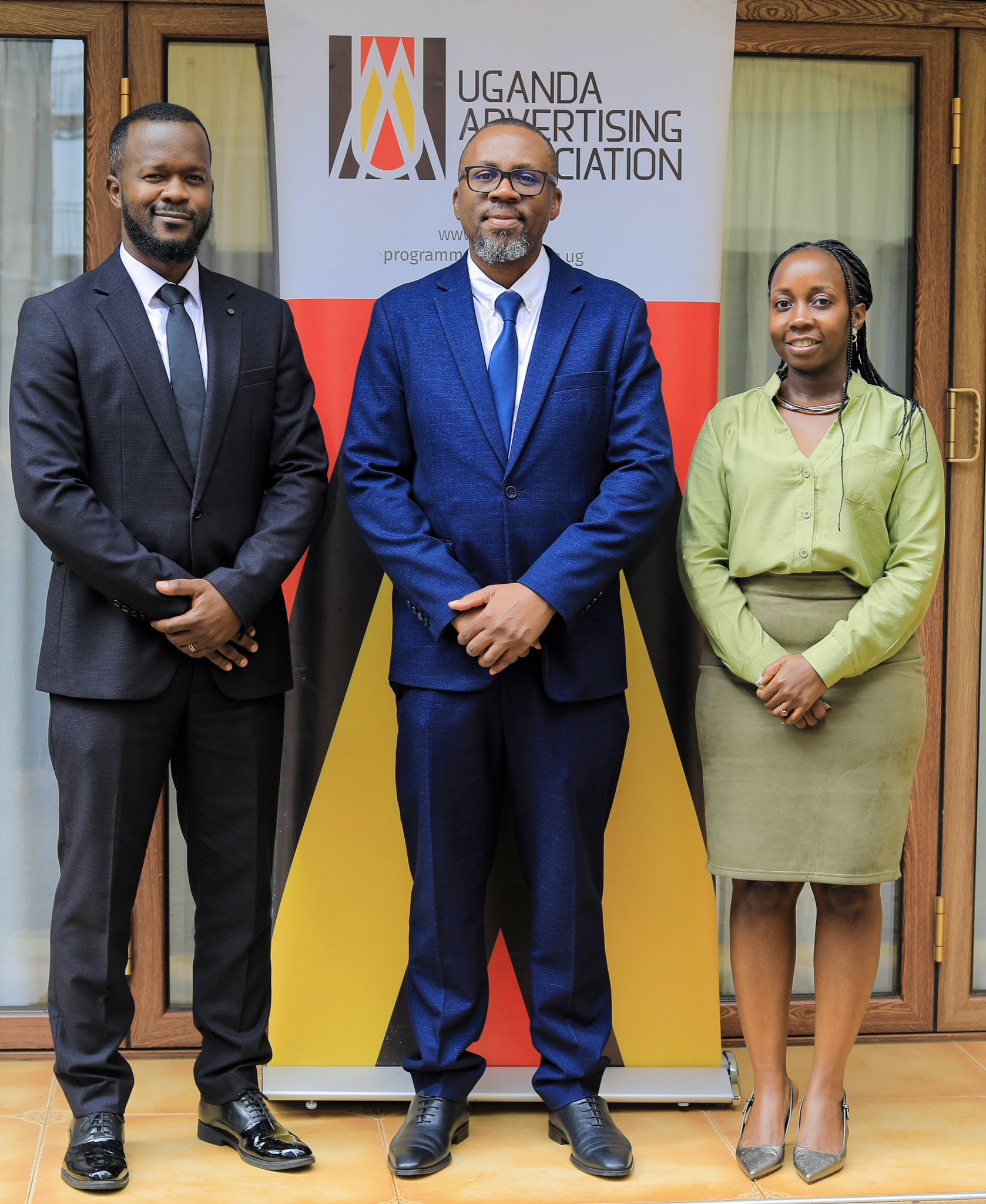 New UAA Chairman Peter Kazibwe and Vice Chairman Allen Suubi Ssempa pose with outgoing Chairman Rommel Jasi during the Uganda Advertising Association leadership handover, marking a new chapter for creative industry growth, reform, and regional influence.