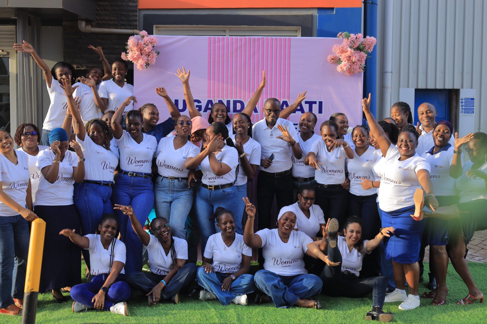 Women staff professionals pose for Photo with the Uganda Baati CEO during Uganda Baati’s “Give to Gain” empowerment forum in Kampala