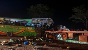 Fourteen people have died and 28 others were injured after a bus collided with a trailer at Bobi Trading Centre along the Kampala–Gulu Highway.