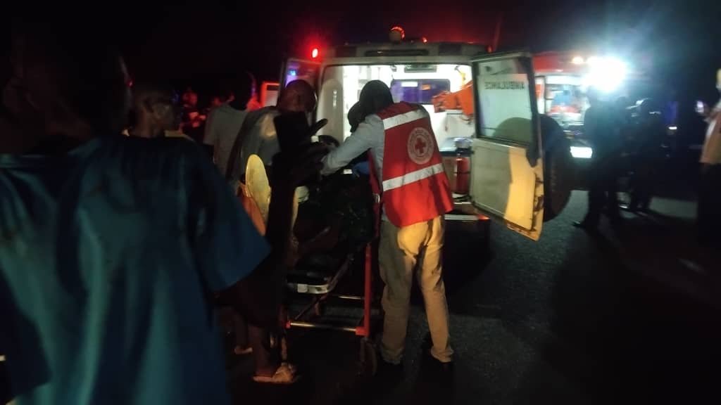 Emergency responders at the scene of the fatal crash involving an OPIT Travellers bus and a trailer at Bobi Trading Centre.